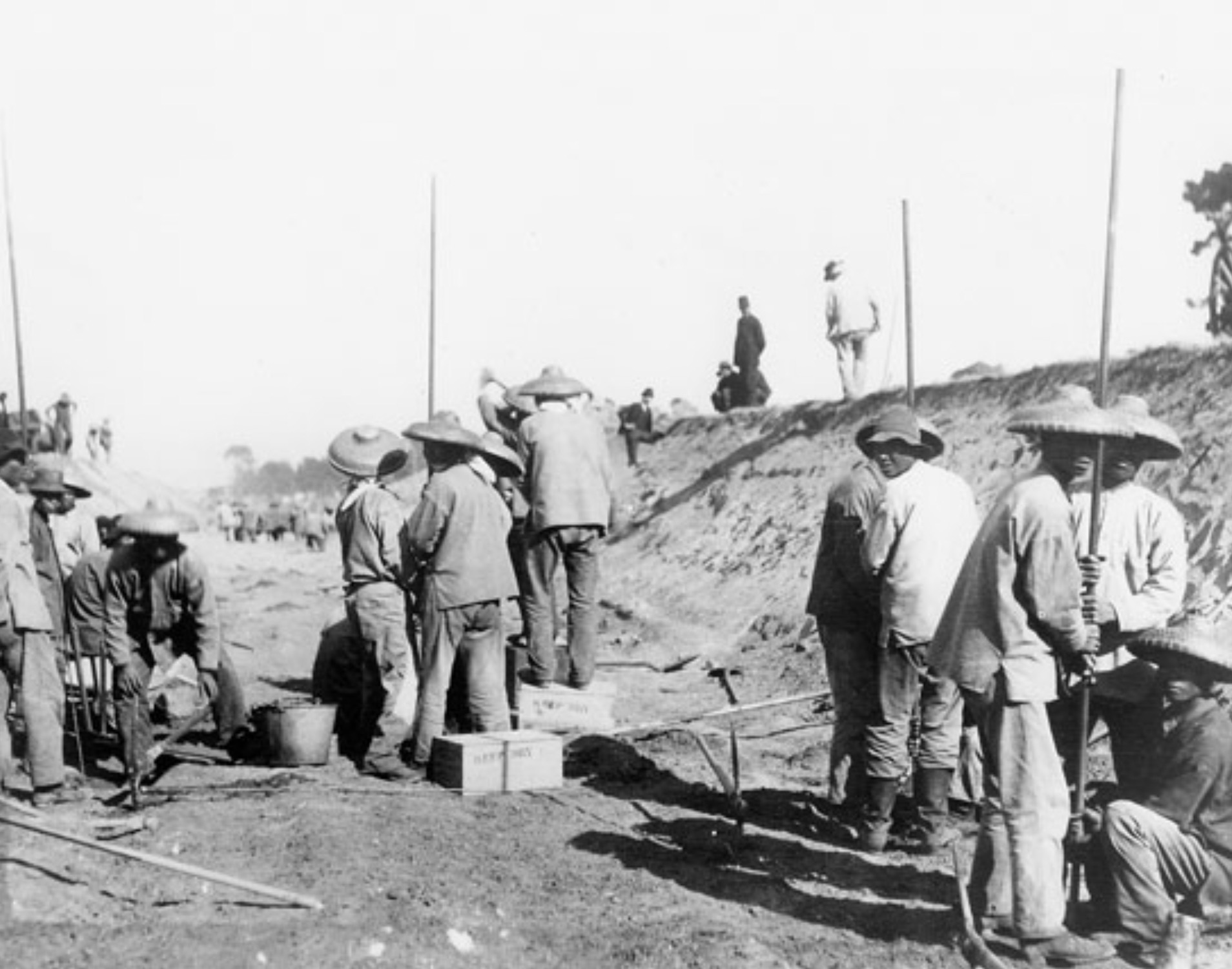 Chinese laborers at work in a cut. 